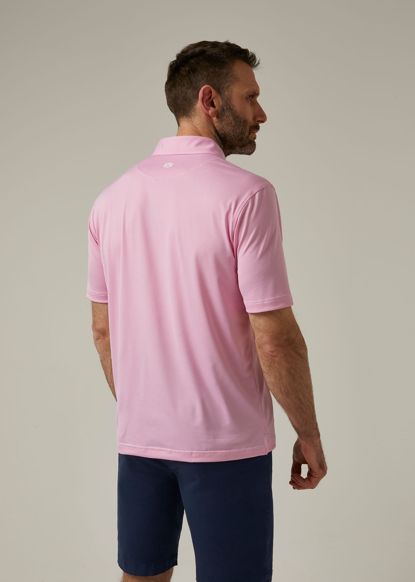 Striped short sleeved polo shirt in carnation pink